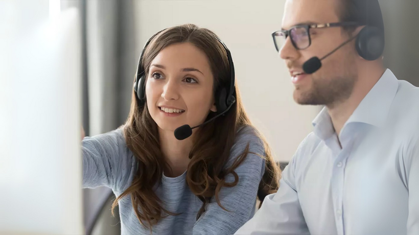 Ivr payments blog man and woman wearing headsets in contact center
