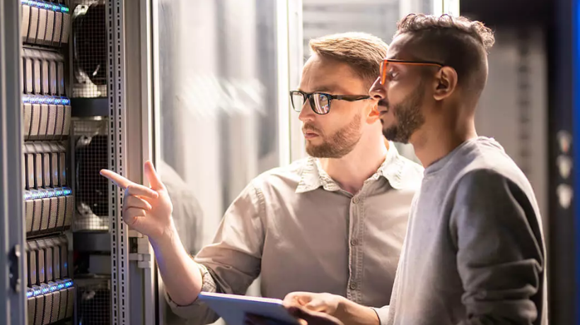 Two men looking at switches
