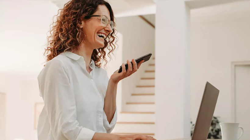 Woman in an office talks on phone