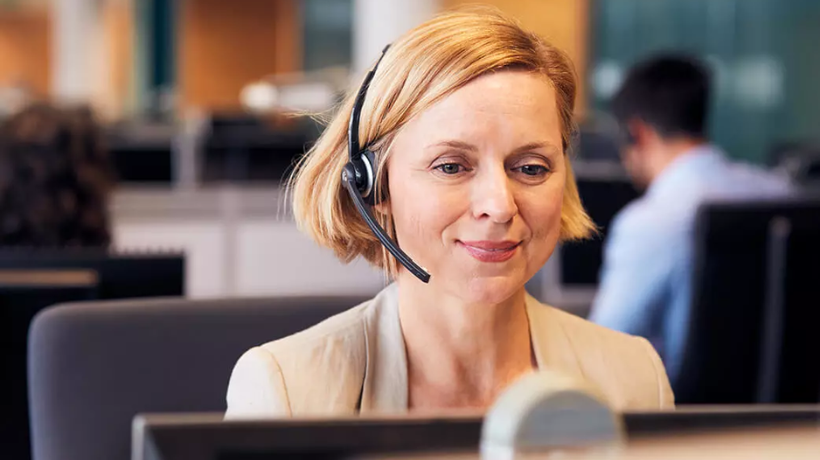 Woman in headset in contact center