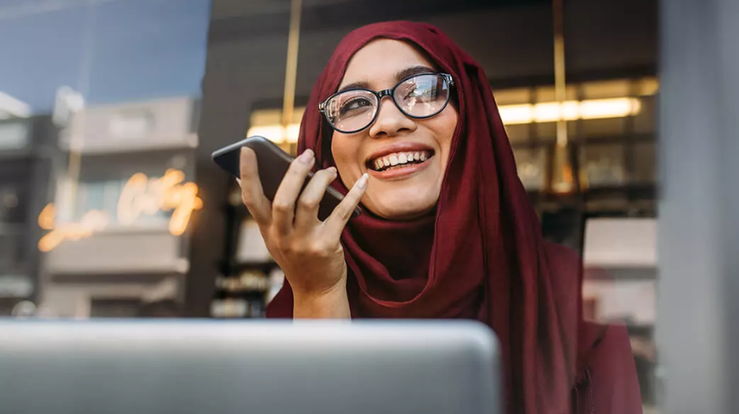 Woman talking into hands free mobile
