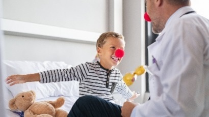 Healthcare doctor with kid red nose 410 x 230px